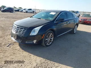 2014 Cadillac XTS Luxury with VIN 2G61M5S35E9228802, listed as a IAAI auction lot 42542501 with 106,506 mi miles and . Bid and sale history available at DreamBid. Image 2.