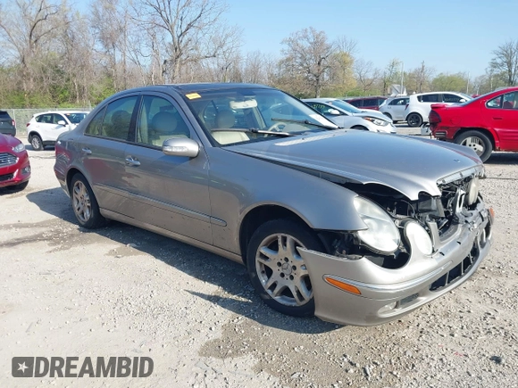 2003 Mercedes-Benz E-Class 3.2L with VIN WDBUF65J93X099223, listed as a IAAI auction lot 42033473 with 230,758 mi miles. Bid and sale history available at carsss.com. Image 1.