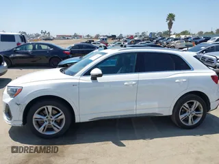 2019 Audi Q3 S line Premium z VIN WA1DECF39K1079763, wystawiony jako IAAI lot #42160517 z przebiegiem 66 924 mil mil oraz . Historia ofert i sprzedaży dostępna na DreamBid. Obrazek 14.