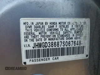 2007 Honda Fit Sport with VIN JHMGD38687S067648, listed as a Copart auction lot 64657345 with 123,055 mi miles and Salvage title. Bid and sale history available at DreamBid. Image 12.