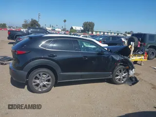 2022 Mazda CX-30 S Premium with VIN 3MVDMBDL6NM407913, listed as a IAAI auction lot 42359860 with 35,804 mi miles and . Bid and sale history available at DreamBid. Image 14.