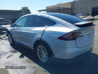 2016 Tesla Model X 70D with VIN 5YJXCAE21GF033123, listed as a IAAI auction lot 39813497 with 162,509 mi miles and . Bid and sale history available at DreamBid. Image 3.