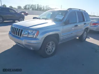 2004 Jeep Grand Cherokee Laredo with VIN 1J4GX48NX4C403936, listed as a IAAI auction lot 40855256 with 241,290 mi miles. Bid and sale history available at carsss.com. Image 2.