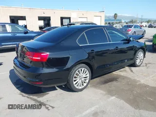 2015 Volkswagen Jetta Sedan 1.8T SE w/Connectivity with VIN 3VWD07AJ6FM354397, listed as a IAAI auction lot 41772983 with 100,265 mi miles. Bid and sale history available at carsss.com. Image 4.