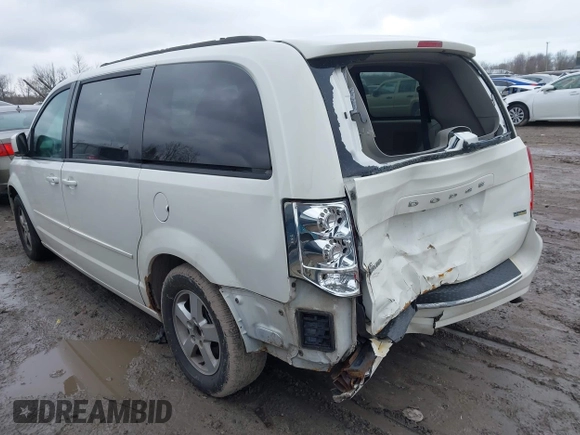 2012 Dodge Grand Caravan SXT with VIN 2C4RDGCG8CR294836, listed as a IAAI auction lot 41995385 with 184,475 mi miles and . Bid and sale history available at DreamBid. Image 3.