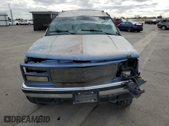 1995 GMC Yukon with VIN 1GKEK18K6SJ710419, listed as a Copart auction lot 80778474 with 215,789 mi miles and Salvage Title. Bid and sale history available at carsss.com. Image 5.