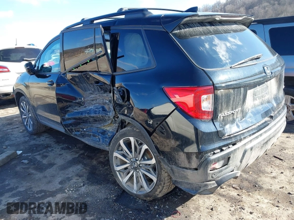 2019 Honda Passport Elite z VIN 5FNYF8H07KB014647, wystawiony jako IAAI lot #41544464 z przebiegiem 82 698 mil mil oraz . Historia ofert i sprzedaży dostępna na DreamBid. Obrazek 3.