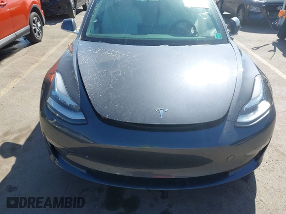 2018 Tesla Model 3 Long Range Battery with VIN 5YJ3E1EBXJF055203, listed as a IAAI auction lot 42019770 with 57,379 mi miles and . Bid and sale history available at DreamBid. Image 12.