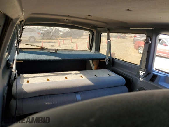 1997 Ford Aerostar XLT z VIN 1FMDA41X7VZA54718, wystawiony jako Copart lot #72972314 z przebiegiem Nie podano mil oraz Szkody całkowita. Historia ofert i sprzedaży dostępna na DreamBid. Obrazek 10.