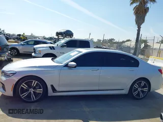 2019 BMW 7 Series 750i with VIN WBA7F0C5XKGM25771, listed as a IAAI auction lot 42167614 with 73,692 mi miles. Bid and sale history available at carsss.com. Image 14.
