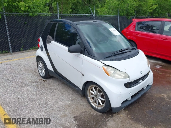 2009 Smart fortwo Passion z VIN WMEEK31X79K210918, wystawiony jako IAAI lot #42316213 z przebiegiem 99 667 mil mil oraz . Historia ofert i sprzedaży dostępna na DreamBid. Obrazek 1.