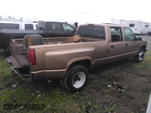 1996 GMC Sierra 1500 with VIN 1GTHC33J4TF010466, listed as a Copart auction lot 48392195 with 143,267 mi miles and Salvage Title. Bid and sale history available at DreamBid. Image 3.
