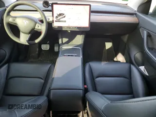 2021 Tesla Model Y Performance with VIN 5YJYGDEF3MF262878, listed as a Copart auction lot 52897595 with 50,939 mi miles and Salvage Title. Bid and sale history available at DreamBid. Image 8.