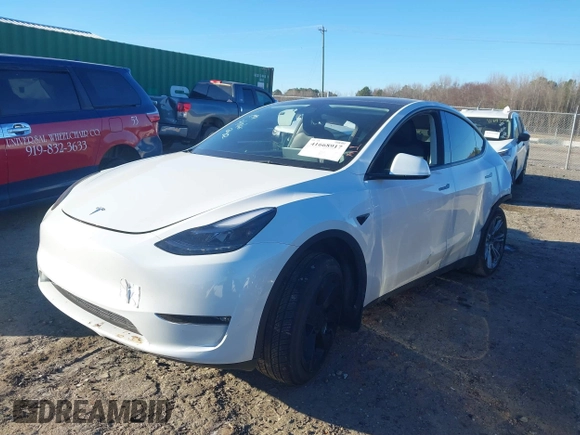 2023 Tesla Model Y Long Range with VIN 7SAYGAEE3PF753657, listed as a IAAI auction lot 41668917 with 33,301 mi miles and . Bid and sale history available at DreamBid. Image 25.