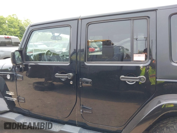 2015 Jeep Wrangler Unlimited Sahara with VIN 1C4HJWEG3FL661568, listed as a IAAI auction lot 42387810 with 140,927 mi miles and . Bid and sale history available at DreamBid. Image 14.