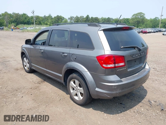 2013 Dodge Journey American Value z VIN 3C4PDCAB0DT691429, wystawiony jako IAAI lot #42514055 z przebiegiem 213 593 mil mil oraz . Historia ofert i sprzedaży dostępna na DreamBid. Obrazek 3.