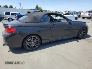 2015 BMW 2 Series M235i with VIN WBA1M1C55FV393315, listed as a Copart auction lot 58587055 with 80,998 mi miles and Salvage title. Bid and sale history available at DreamBid. Image 3.