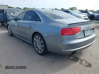 2011 Audi A8 with VIN WAUAVAFD5BN021080, listed as a IAAI auction lot 41223418 with 80,538 mi miles and . Bid and sale history available at DreamBid. Image 3.