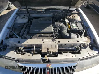 1996 Lincoln Continental z VIN 1LNLM97V3TY627803, wystawiony jako Copart lot #87036654 z przebiegiem 118 078 mil mil oraz Szkoda całkowita • Salvage title. Historia ofert i sprzedaży dostępna na DreamBid. Obrazek 11.