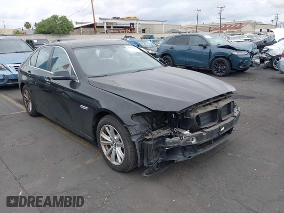 2015 BMW 5 Series 528i with VIN WBA5A5C56FD514814, listed as a IAAI auction lot 42052381 with 76,306 mi miles. Bid and sale history available at carsss.com. Image 1.