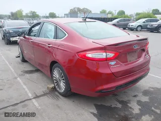 2014 Ford Fusion Titanium Hybrid with VIN 3FA6P0RU9ER349599, listed as a IAAI auction lot 41928864 with 94,312 mi miles. Bid and sale history available at carsss.com. Image 3.