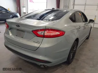 2013 Ford Fusion SE Hybrid with VIN 3FA6P0LUXDR355984, listed as a IAAI auction lot 41977367 with 244,310 mi miles. Bid and sale history available at carsss.com. Image 4.