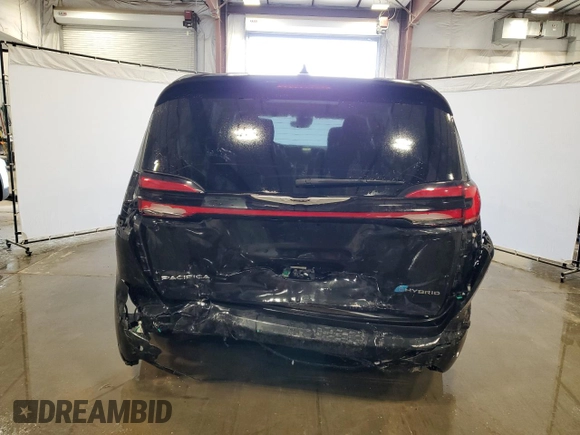 2023 Chrysler Pacifica Hybrid Limited with VIN 2C4RC1S75PR626237, listed as a Copart auction lot 60257305 with 61,864 mi miles and Salvage title. Bid and sale history available at DreamBid. Image 6.