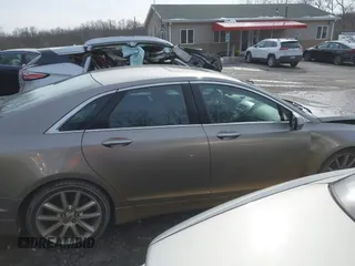 2015 Lincoln MKZ z VIN 3LN6L2JK4FR610596, wystawiony jako IAAI lot #41443285 z przebiegiem 114 363 mil mil oraz . Historia ofert i sprzedaży dostępna na DreamBid. Obrazek 13.
