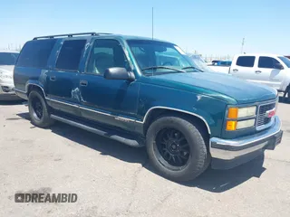 1996 GMC Suburban with VIN 3GKEC16R2TG522612, listed as a IAAI auction lot 42544124 with 174,371 mi miles and . Bid and sale history available at DreamBid. Image 1.