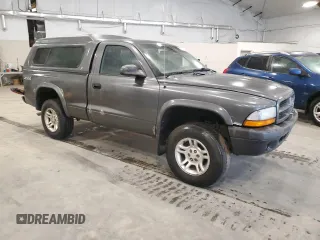 2003 Dodge Dakota z VIN 1D7GG16X23S204317, wystawiony jako Copart lot #54830745 z przebiegiem 139 508 mil mil oraz Szkoda całkowita • Salvage title. Historia ofert i sprzedaży dostępna na DreamBid. Obrazek 4.