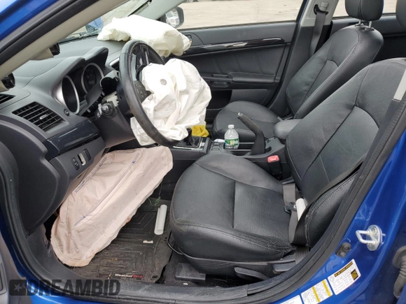 2015 Mitsubishi Lancer Evolution GSR z VIN JA32W8FV7FU023106, wystawiony jako Copart lot #40867084 z przebiegiem 103 964 mil mil oraz Szkoda całkowita • Salvage title. Historia ofert i sprzedaży dostępna na DreamBid. Obrazek 7.