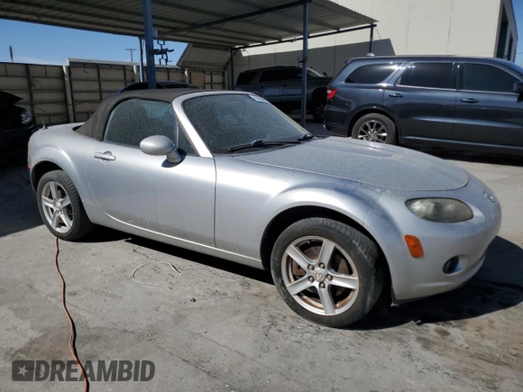 2007 Mazda MX-5 Miata Sport with VIN JM1NC25F470128936, listed as a Copart auction lot 45424585 with 123,910 mi miles and Salvage title. Bid and sale history available at DreamBid. Image 4.
