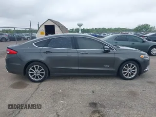 2017 Ford Fusion Energi SE with VIN 3FA6P0PU9HR227932, listed as a IAAI auction lot 42177500 with 106,938 mi miles. Bid and sale history available at carsss.com. Image 13.