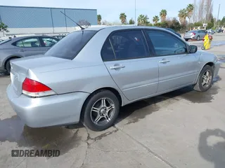2004 Mitsubishi Lancer ES with VIN JA3AJ26E54U052124, listed as a IAAI auction lot 41804473 with 165,786 mi miles. Bid and sale history available at carsss.com. Image 4.