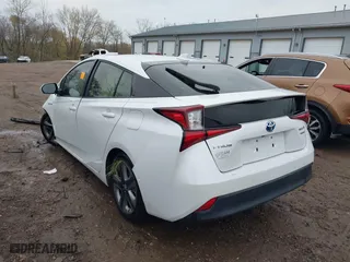 2021 Toyota Prius L Eco with VIN JTDKAMFUXM3137233, listed as a IAAI auction lot 40870395 with 60,000 mi miles. Bid and sale history available at carsss.com. Image 3.