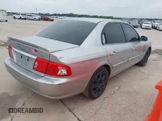 2003 Kia Optima LX z VIN KNAGD128235248556, wystawiony jako IAAI lot #42366002 z przebiegiem 140 904 mil mil oraz . Historia ofert i sprzedaży dostępna na DreamBid. Obrazek 4.