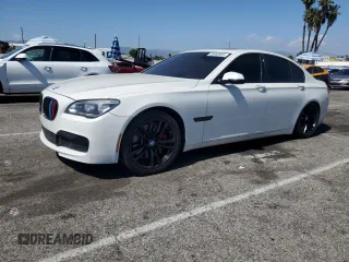 2013 BMW 7 Series 750i with VIN WBAYA8C54DC996412, listed as a Copart auction lot 56982895 with 124,258 mi miles and Salvage title. Bid and sale history available at DreamBid. Image 1.