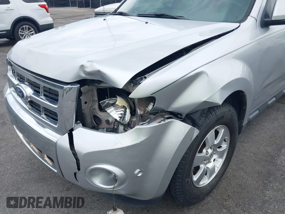 2010 Ford Escape Limited z VIN 1FMCU0E72AKD30702, wystawiony jako IAAI lot #42093802 z przebiegiem 155 572 mil mil oraz . Historia ofert i sprzedaży dostępna na DreamBid. Obrazek 6.