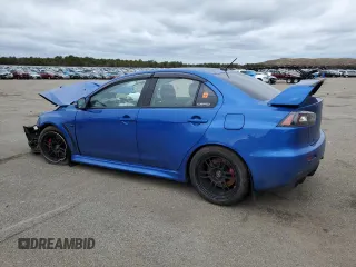 2015 Mitsubishi Lancer Evolution GSR z VIN JA32W8FV7FU023106, wystawiony jako Copart lot #40867084 z przebiegiem 103 964 mil mil oraz Szkody całkowita. Historia ofert i sprzedaży dostępna na DreamBid. Obrazek 2.