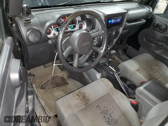 2009 Jeep Wrangler Rubicon with VIN 1J4GA64159L770895, listed as a Copart auction lot 82140864 with 209,464 mi miles and Salvage Title. Bid and sale history available at DreamBid. Image 8.