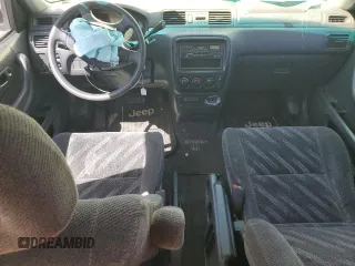 1999 Honda CR-V LX with VIN JHLRD2847XC019705, listed as a Copart auction lot 52220675 with 236,219 mi miles and Salvage Title. Bid and sale history available at carsss.com. Image 8.