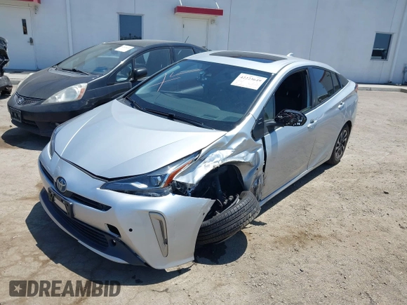 2022 Toyota Prius L Eco with VIN JTDKAMFU5N3188107, listed as a IAAI auction lot 42223649 with 180,894 mi miles and . Bid and sale history available at DreamBid. Image 6.