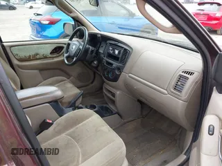 2001 Mazda Tribute LX with VIN 4F2CU08141KM10269, listed as a IAAI auction lot 42138704 with 166,825 mi miles and . Bid and sale history available at carsss.com. Image 5.