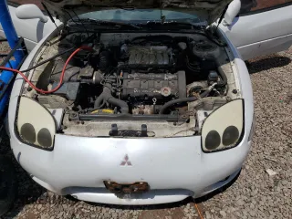 1998 Mitsubishi 3000GT GT z VIN JA3AM84J7WY003884, wystawiony jako Copart lot #59136565 z przebiegiem 274 171 mil mil oraz Tytuł czysty. Historia ofert i sprzedaży dostępna na DreamBid. Obrazek 11.