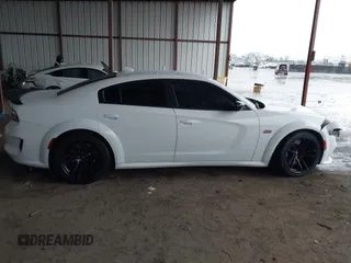 2023 Dodge Charger Scat Pack Widebody with VIN 2C3CDXGJ9PH516473, listed as a IAAI auction lot 41188167 with 38,021 mi miles and . Bid and sale history available at DreamBid. Image 13.