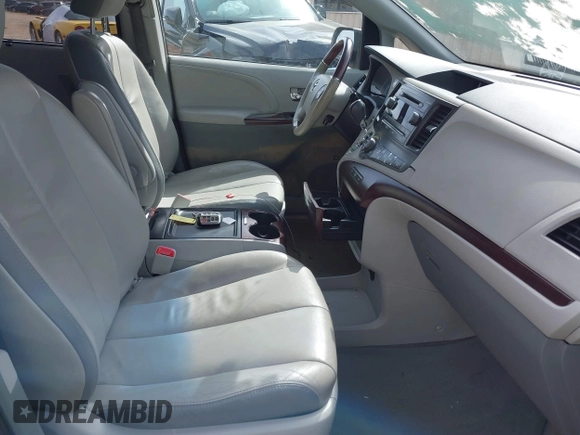 2012 Toyota Sienna XLE with VIN 5TDDK3DC3CS041984, listed as a IAAI auction lot 41711974 with 149,879 mi miles. Bid and sale history available at carsss.com. Image 5.
