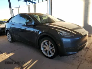 2021 Tesla Model Y Long Range with VIN 5YJYGDEEXMF151557, listed as a Copart auction lot 54936885 with 106,411 mi miles and Salvage Title. Bid and sale history available at DreamBid. Image 4.