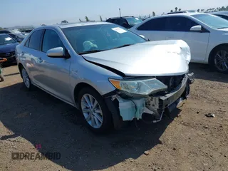 2012 Toyota Camry XLE z VIN 4T1BD1FK6CU022878, wystawiony jako IAAI lot #42476522 z przebiegiem 154 824 mil mil oraz . Historia ofert i sprzedaży dostępna na DreamBid. Obrazek 1.