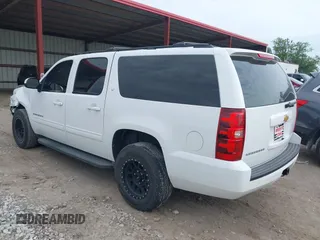 2013 Chevrolet Suburban LT with VIN 1GNSCJE05DR147101, listed as a IAAI auction lot 42336950 with 147,429 mi miles and . Bid and sale history available at DreamBid. Image 3.