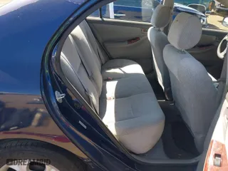 2004 Toyota Corolla CE with VIN JTDBR32E342025798, listed as a IAAI auction lot 42030391 with 224,434 mi miles. Bid and sale history available at carsss.com. Image 8.